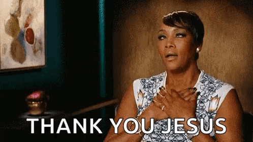 a woman is saying thank you jesus with her hands on her chest .