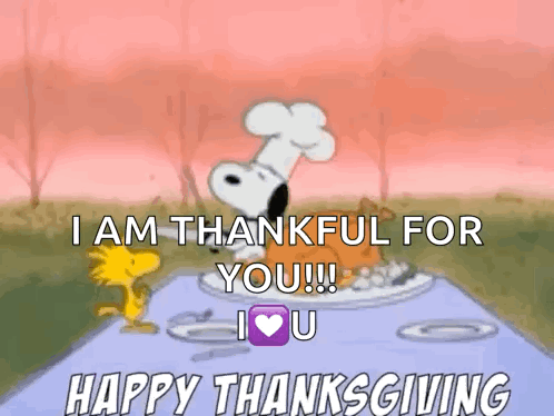 a cartoon of snoopy and woodstock sitting at a table with a plate of food .