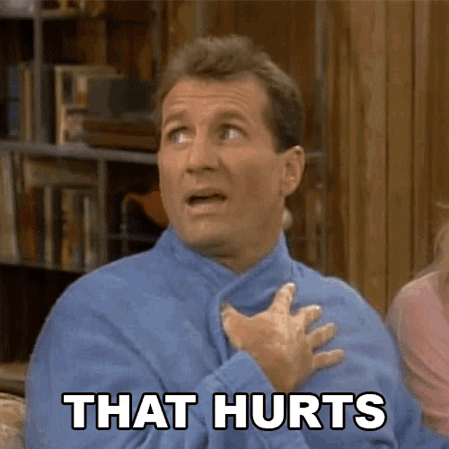 Al Bundy touches his chest while the caption says “THAT HURTS.”