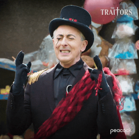 a man wearing a top hat and gloves with the peacock logo on the bottom