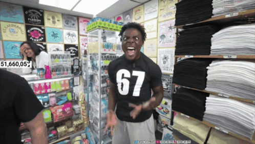 a man wearing a black shirt with 67 on it