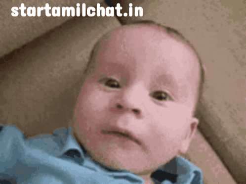 A baby looks quietly sad at the camera with a Startamilchat watermark.