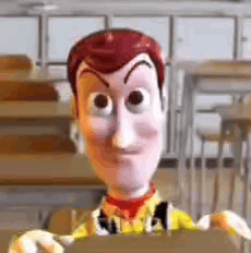 woody from toy story is holding a piece of cardboard in a classroom .