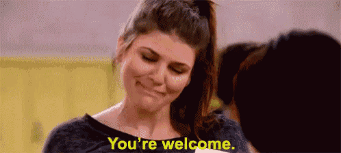 A woman offers an awkward smile while subtitles read “You're welcome.”