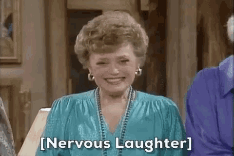 A woman laughs tensely as the subtitle reads “[Nervous Laughter].”