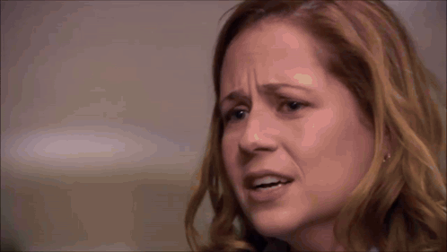 Pam from The Office looks distressed in a close reaction shot.
