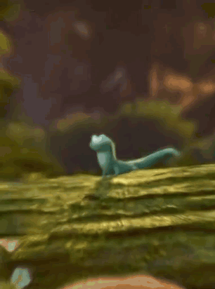 A green lizard appears on a mossy branch.