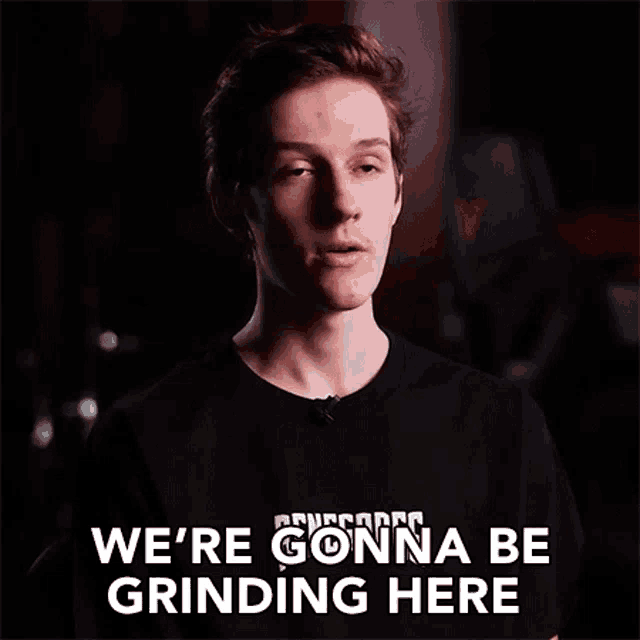 a young man wearing a black t-shirt says we 're gonna be grinding here