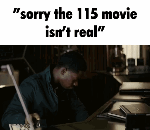 a man sitting at a desk with the words " sorry the 115 movie is n't real "