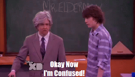 two men are standing in front of a chalkboard that says mr. elderman on it