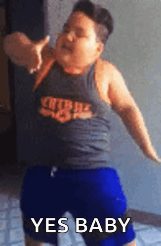 A person in a dark tank top dances with the caption “YES BABY.”