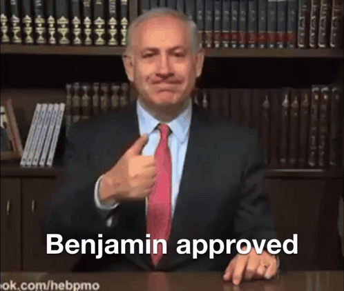 a man in a suit and tie is giving a thumbs up and the words benjamin approved behind him
