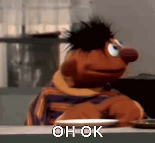 Ernie from Sesame Street scratches his head with “OH OK” text.