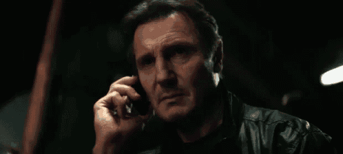 A serious man on a phone says “GOOD. LUCK.”