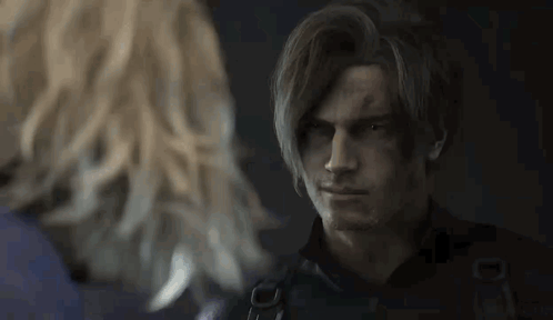 a man and a woman are standing next to each other in a dark room .