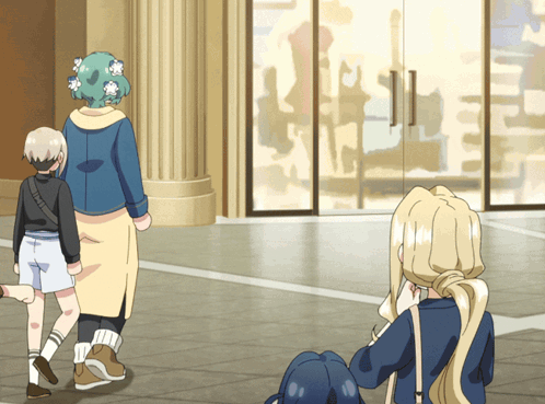 a woman with flowers in her hair walks down a sidewalk