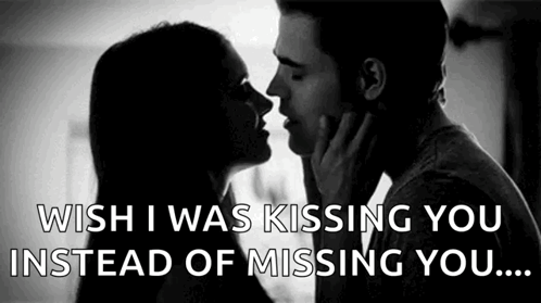 A silhouetted couple touches faces under “WISH I WAS KISSING YOU INSTEAD OF MISSING YOU...” text.