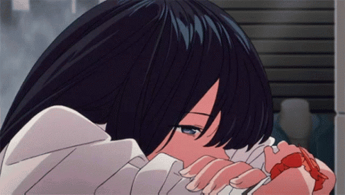 An anime character rests their face on their arms with a sorrowful look.