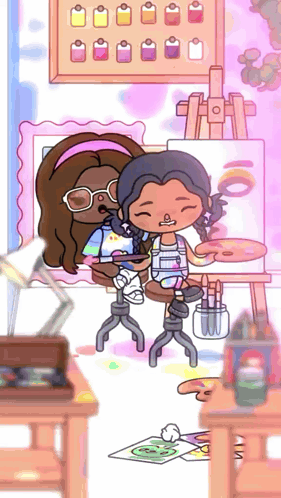 two girls are sitting in front of an easel and painting