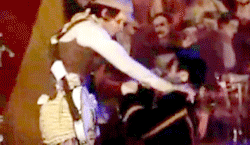a blurry picture of a man in a suit dancing