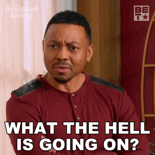 a man in a red shirt is asking what the hell is going on