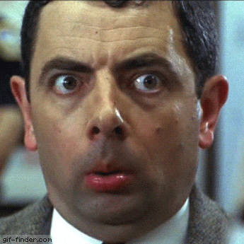 Mr. Bean makes a wide-eyed silly face.