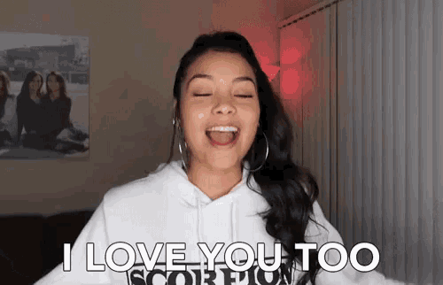 a woman in a white hoodie says " i love you too scorpion "