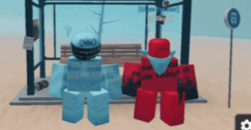 a blue and red robot are standing next to each other at a bus stop .