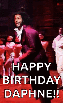 a man is dancing on a stage with the words `` happy birthday daphine '' .