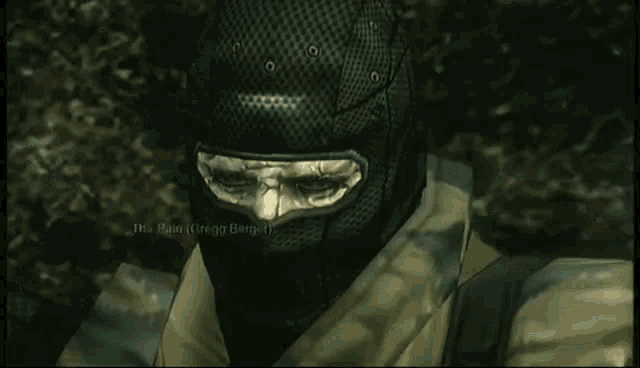 a man with a bandana on his head is standing in a dark cave