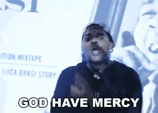 a man says god have mercy in front of a luca brasi story poster