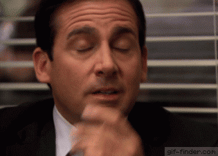 Michael Scott closes his eyes and exhales in a deep sigh.