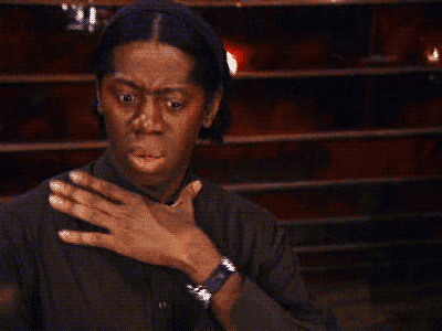 Miss J Alexander clutches their chest in shocked disbelief.