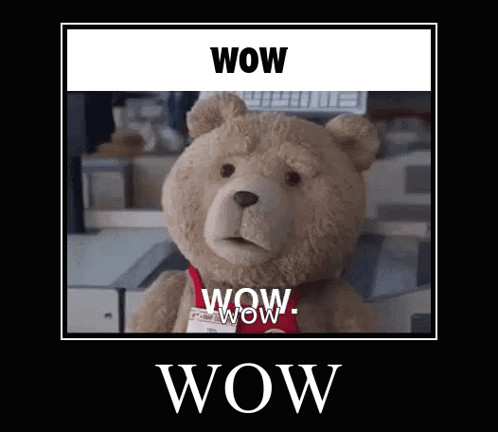 Ted the teddy bear stares blankly beneath a framed WOW caption.