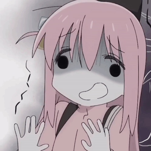 Hitori Gotoh trembles with a nervous grimace and raised hands.
