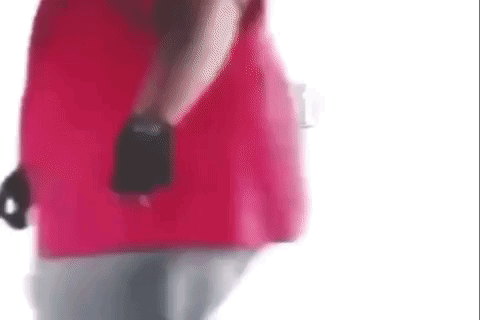a man in a red shirt and black gloves is standing on a white background .