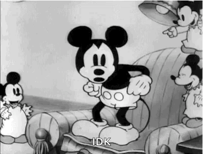Vintage black-and-white Mickey Mouse shrugs with the caption “IDK.”