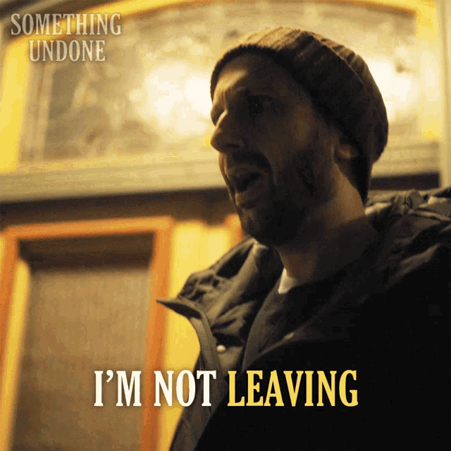 a man wearing a beanie says something undone i 'm not leaving