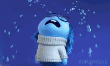 A blue animated character cries under falling raindrops.