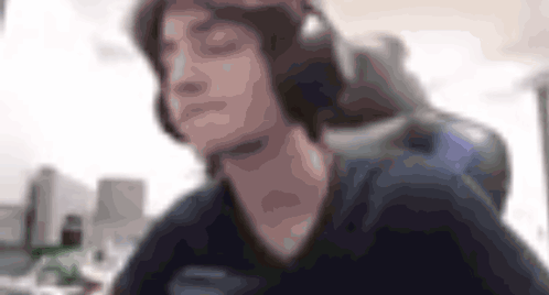 a blurry image of a person wearing headphones
