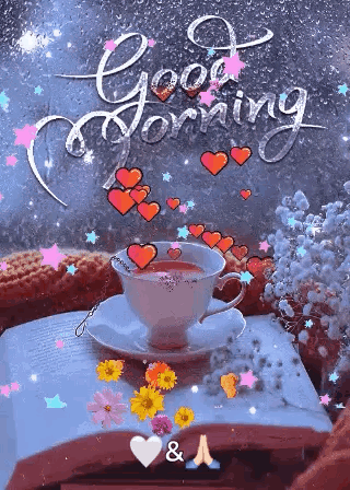 a cup of coffee is sitting on top of a book on a table with hearts and flowers .