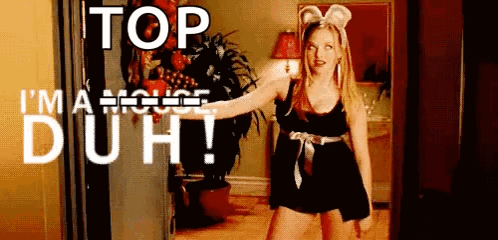 Amanda Seyfried as Karen wears mouse ears in Mean Girls, captioned “TOP I’M A MOUSE, DUH!”.