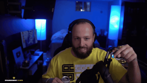 a man wearing headphones and a yellow shirt with the letters ecg on it