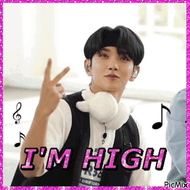 a young man wearing headphones and a headband is making a peace sign and says i 'm high .