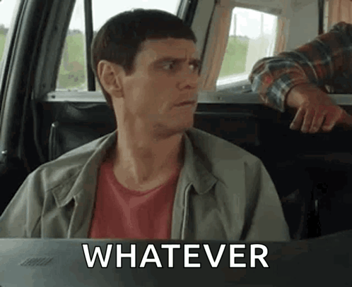 Jim Carrey looks sideways from a car with “WHATEVER” text.