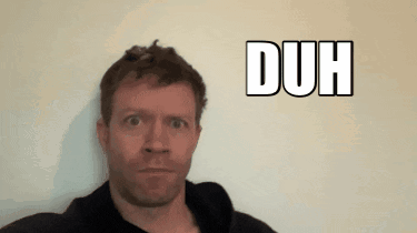 A man stares blankly at the camera beside a large “DUH” caption.