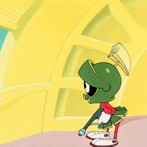 Marvin the Martian walks through a bright yellow cartoon interior.