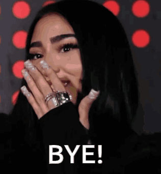 A woman covers her mouth with her hand as “BYE!” appears below.