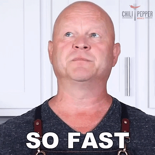 a man wearing an apron says so fast