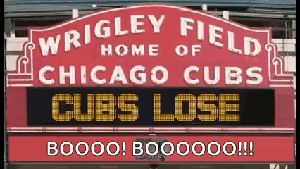 a sign that says `` wrigley field home of chicago cubs ''